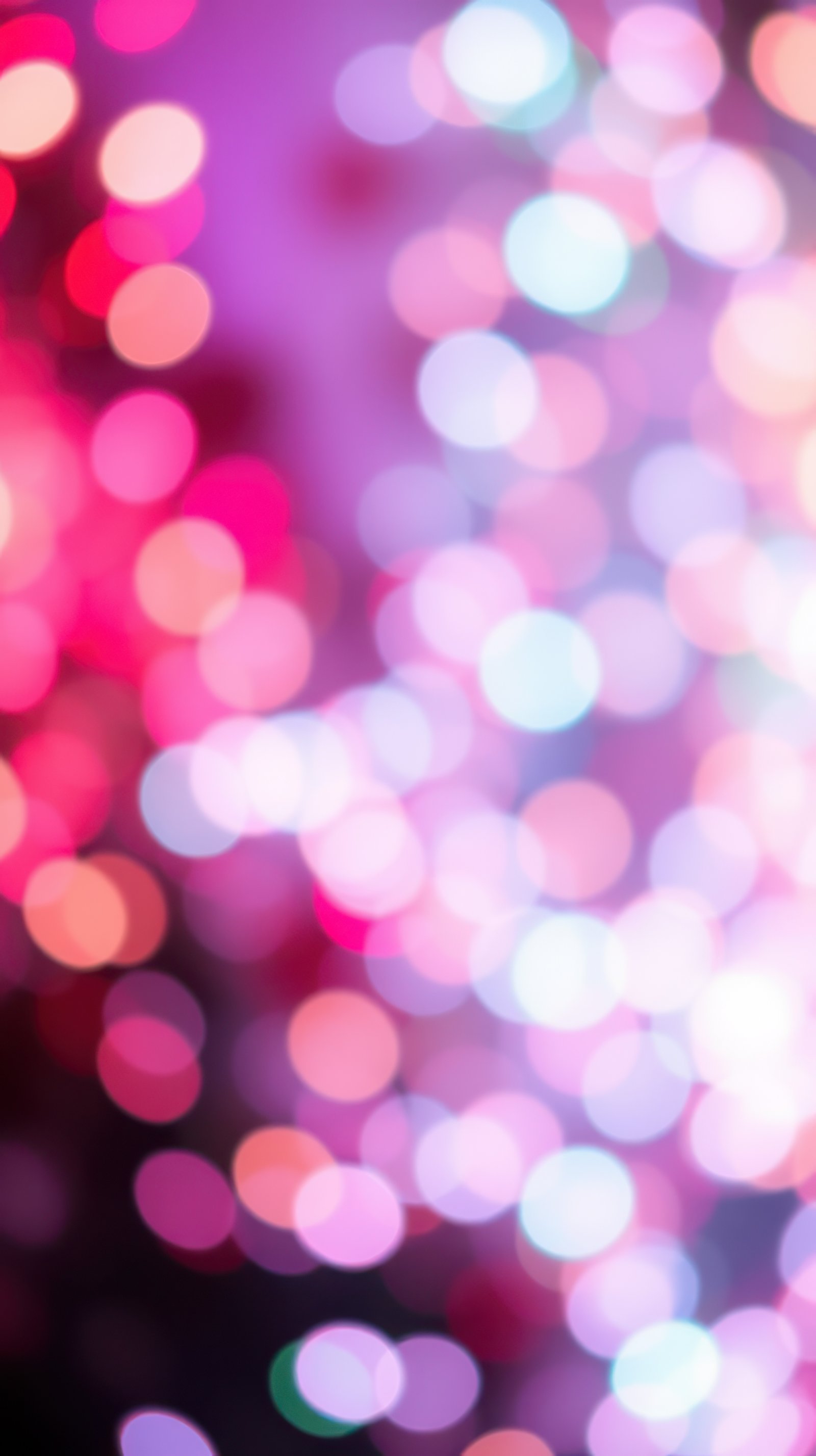 Bright and colorful bokeh lights creating a festive atmosphere during a celebration at night